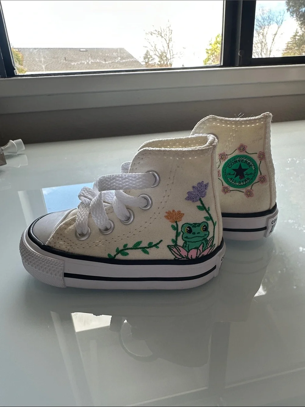 Brand new size 2 infant converse high top with cute frog and floral design